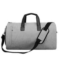 Medium oval travel bag in light grey oxford cloth, open to show internal organiser bags including camera insert and document pockets.