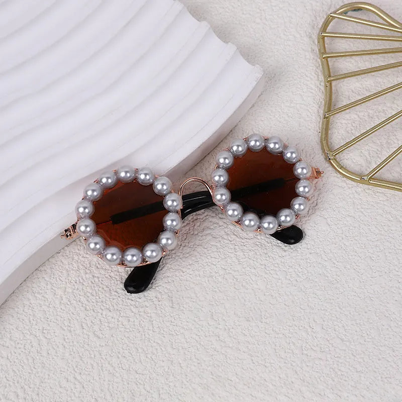 Pearl-rimmed round sunglasses for pets on cat and dog with black, blue, coffee, orange and purple colour options