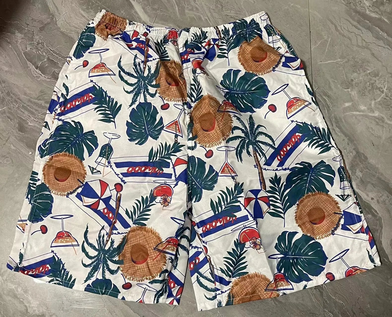 Men's floral print five-point swimming trunks in polyester fabric, free size