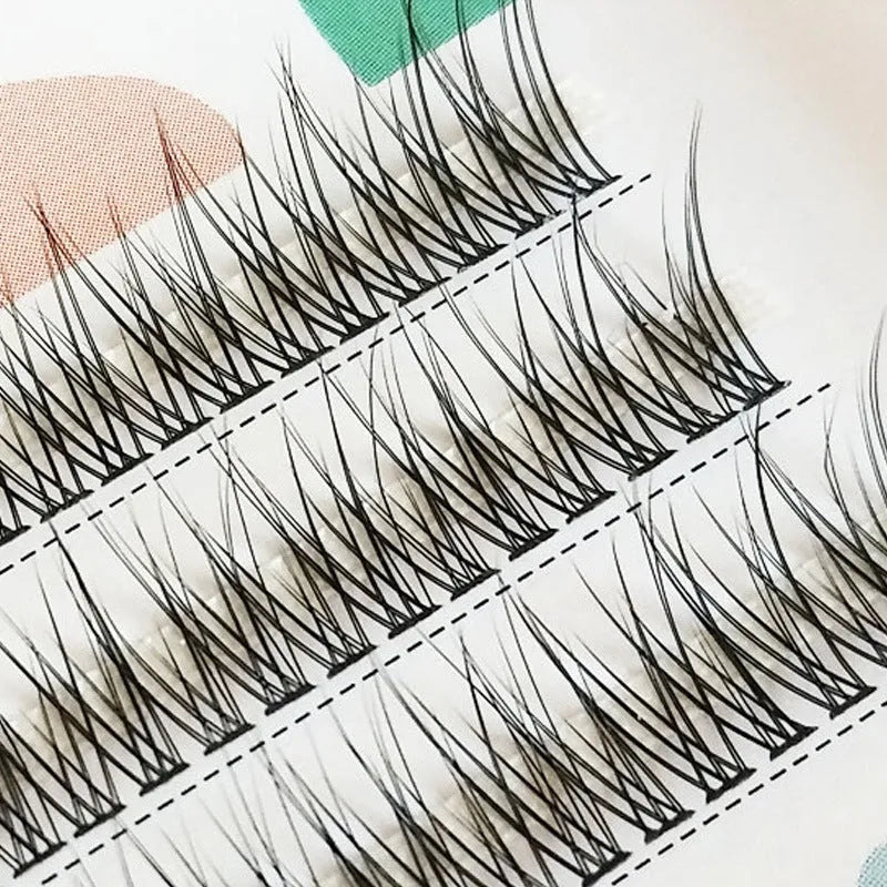 Black V-shaped fairy fishtail false eyelashes with thick segments, shown in graded lengths from 8mm to 12mm