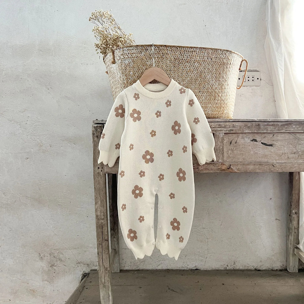 Baby romper jumpsuit in cotton with long sleeves, pink flowers pattern, side view