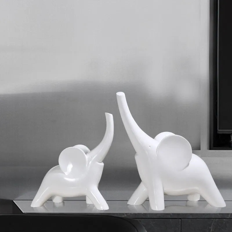 Minimalist solid resin elephant ornament in rose gold on a shelf.