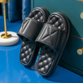A pair of soft EVA bathroom slippers with a thick non-slip sole, shown in a choice of colours.