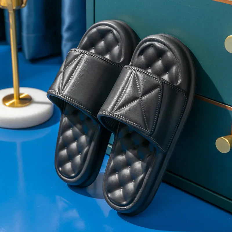 A pair of soft EVA bathroom slippers with a thick non-slip sole, shown in a choice of colours.