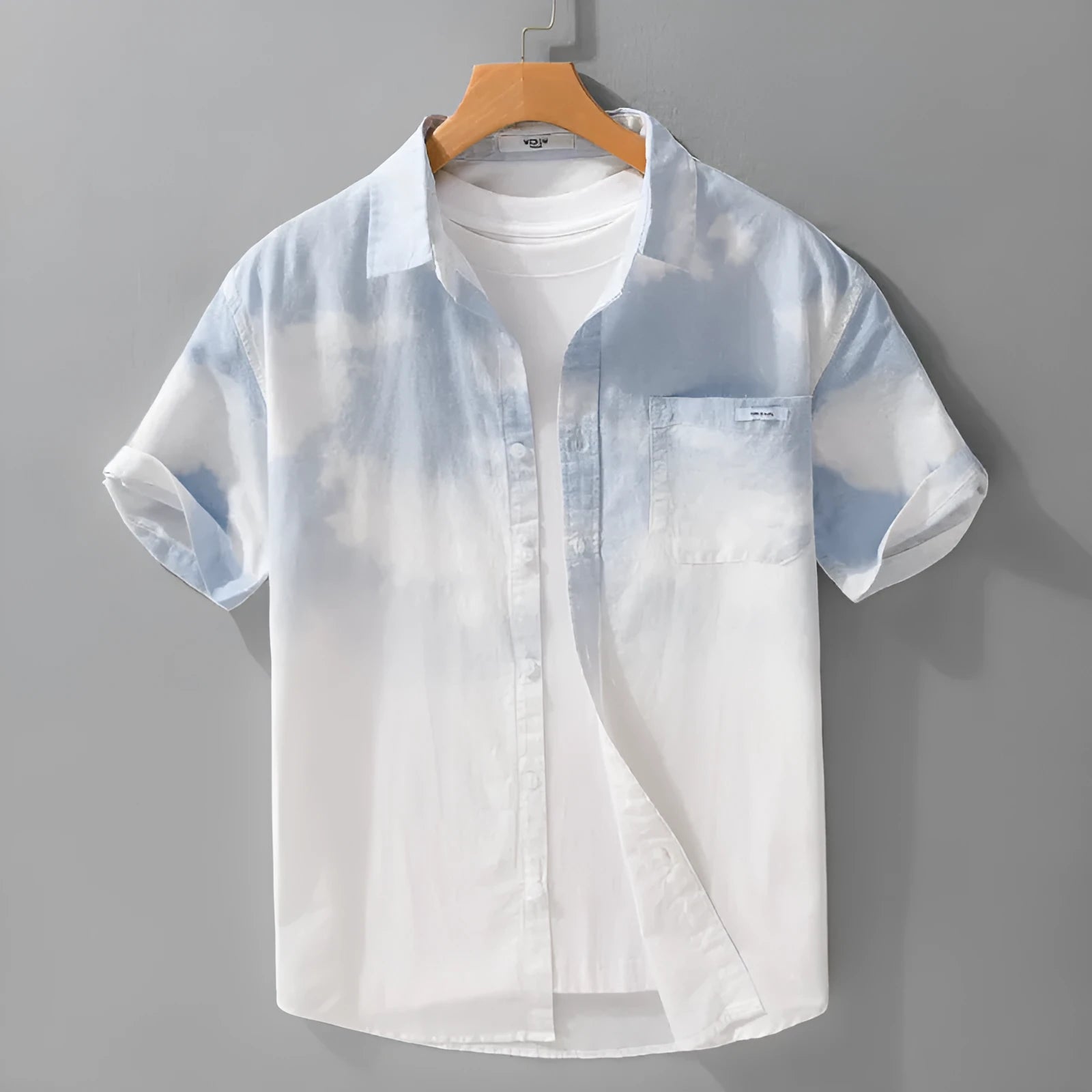 Man modelling a light pink loose-fitting pure cotton short-sleeved cardigan shirt.