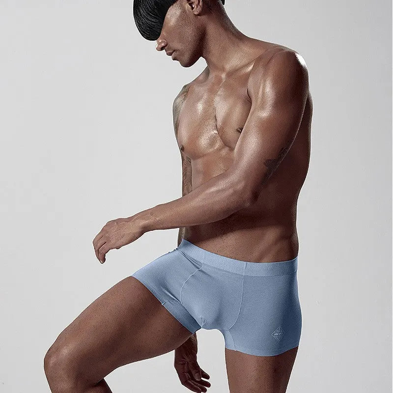 Seamless one-piece men's underwear in modal fabric showing mid waist design