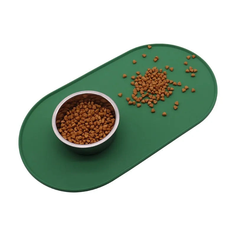 Green silicone waterproof cat feeding placemat with non-slip backing under a food bowl