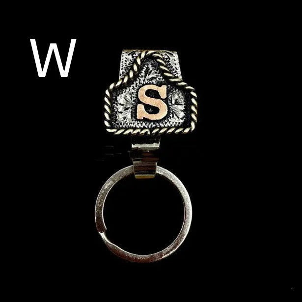 Handmade metal keychain with a cow tag charm in one of 26 available colour options.