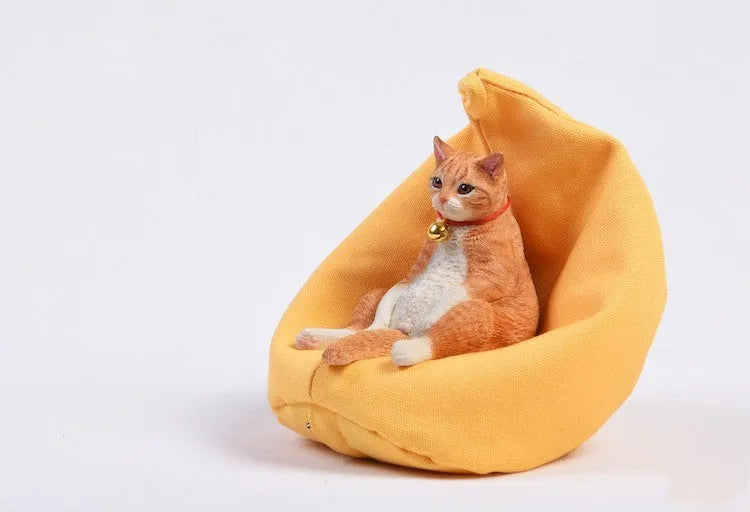 Small 7.5cm lazy cat ornament with sofa on car dashboard