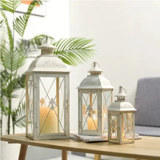 Black and white gold wrought iron storm lantern with tempered glass in three sizes for courtyard decoration.