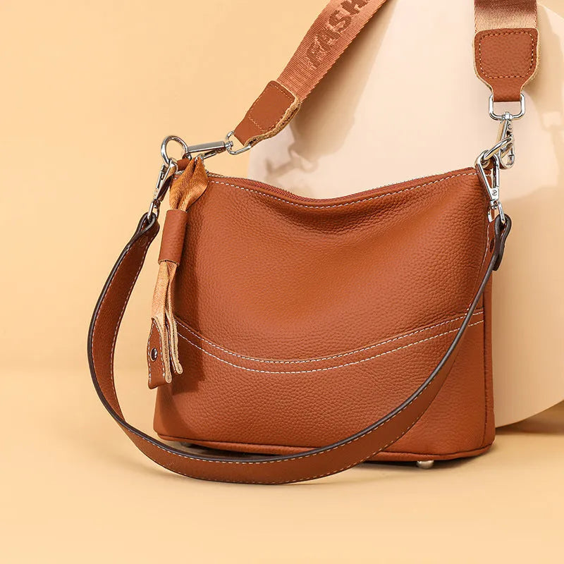 Genuine leather crossbody bag in black with spliced design and multiple internal pockets