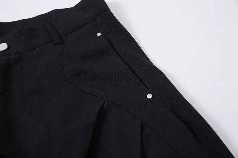 Black men's loose-fitting cotton pleated trousers with a wide-leg casual style.