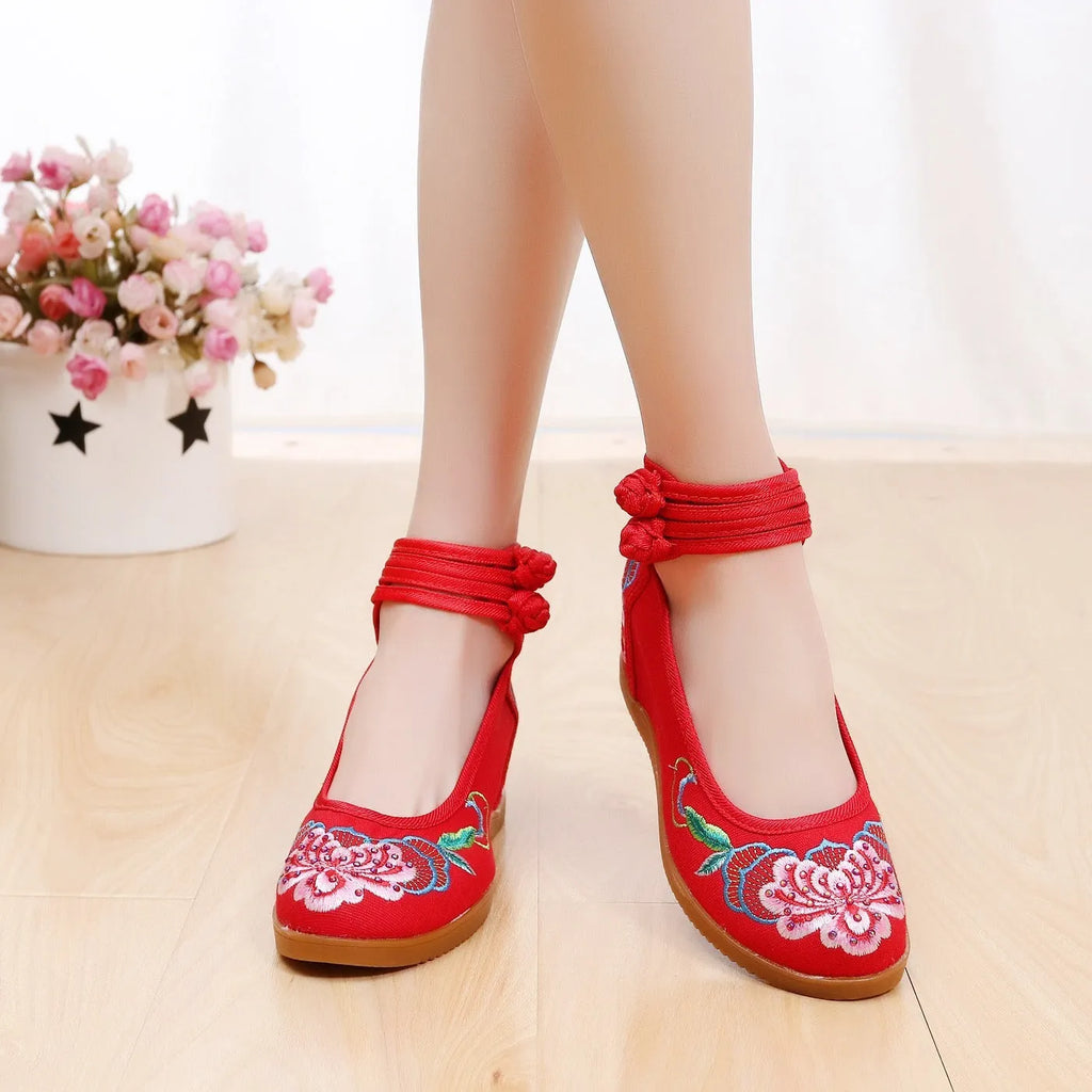 Women's canvas high heels with ethnic pattern, rhinestone detail, and double buckle in beige colour