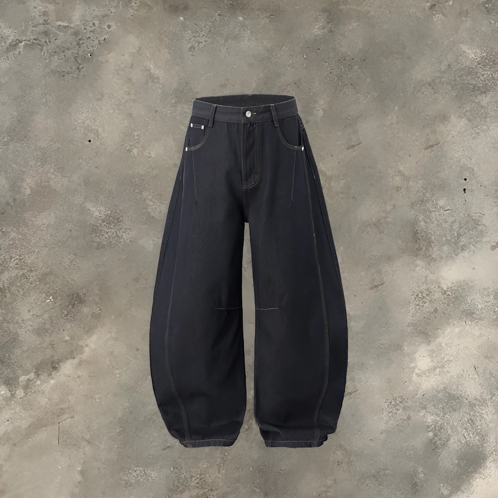 Men's original cow colour wide leg denim trousers laid flat showing mid-waist and relaxed leg cut