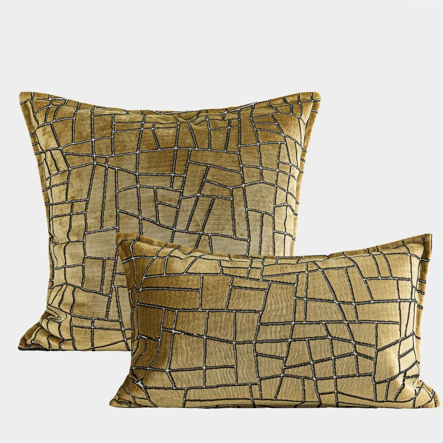 Gold geometric abstract pattern on a square polyester cushion cover with tassel detail.