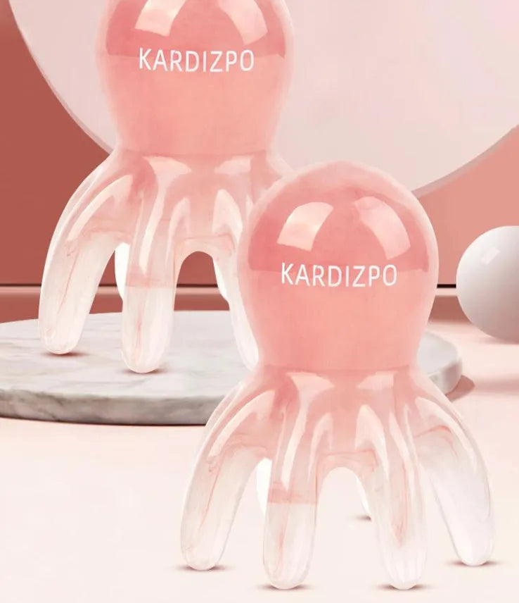 Pink octopus-shaped massage comb for facial meridian stimulation with storage bag