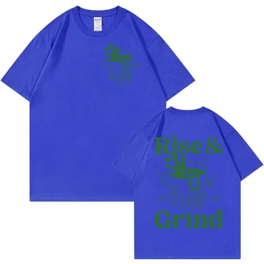 Man wearing a loose black T-shirt with a colourful Rise and Grind coffee cartoon and expression bag graphic.