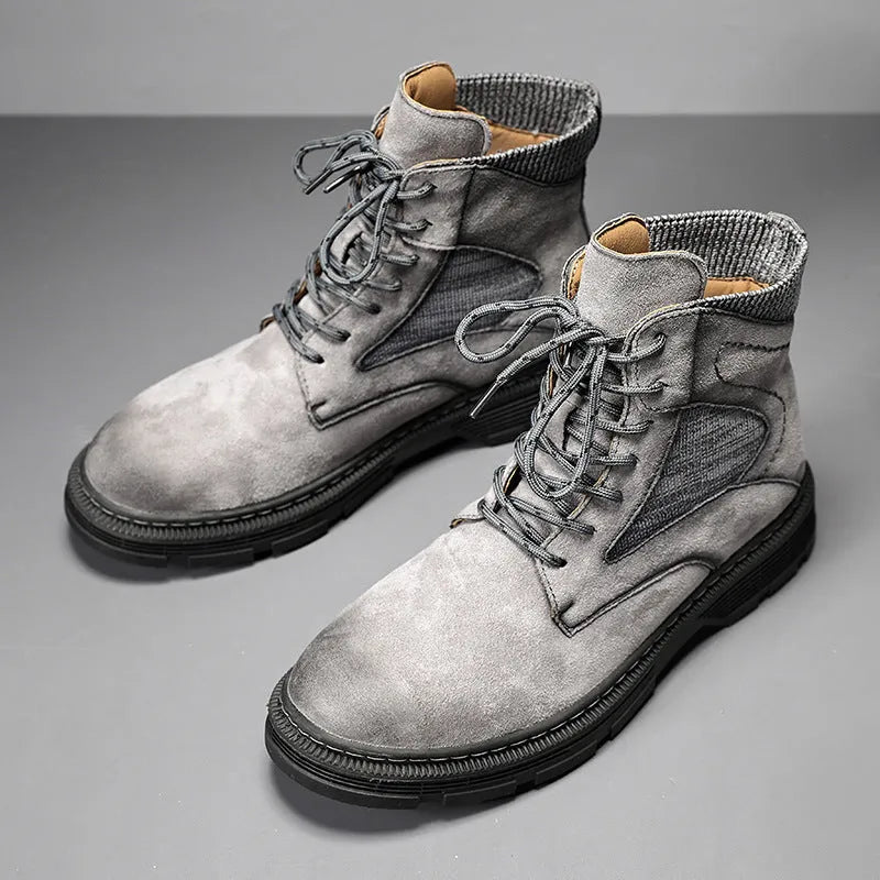 Men's vintage Martin boots in black with a round toe and low thick heel on a rubber sole.