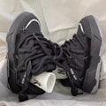 Women's grey retro clunky sneakers with thick rubber sole and lace-up front, showing 6-8cm heel height