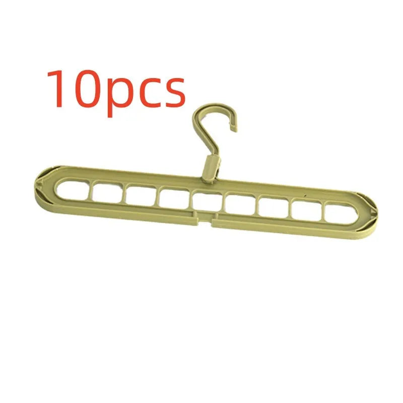 Green plastic nine-hole folding hanger for trousers displayed open and folded flat.