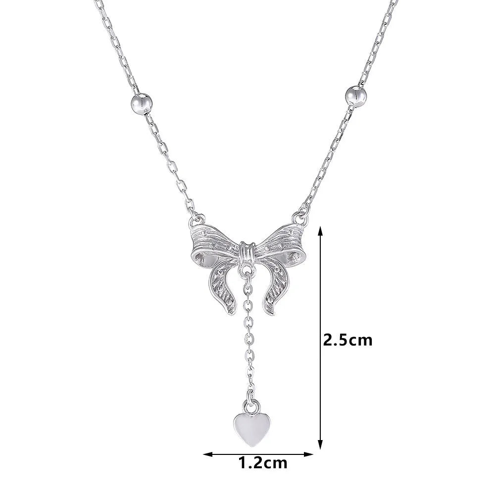 925 sterling silver necklace with a detailed butterfly and heart-shaped pendant on an adjustable O-ring chain.
