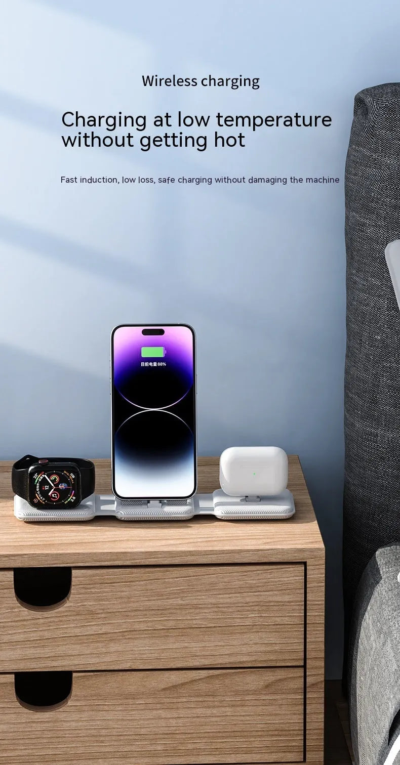 A75 Three-in-one Wireless Charger in white, charging a smartphone, earbuds, and smartwatch on a desk