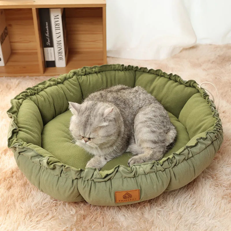 Grey and green reversible donut-shaped cat bed for indoor pets, shown in small, medium, and large sizes.