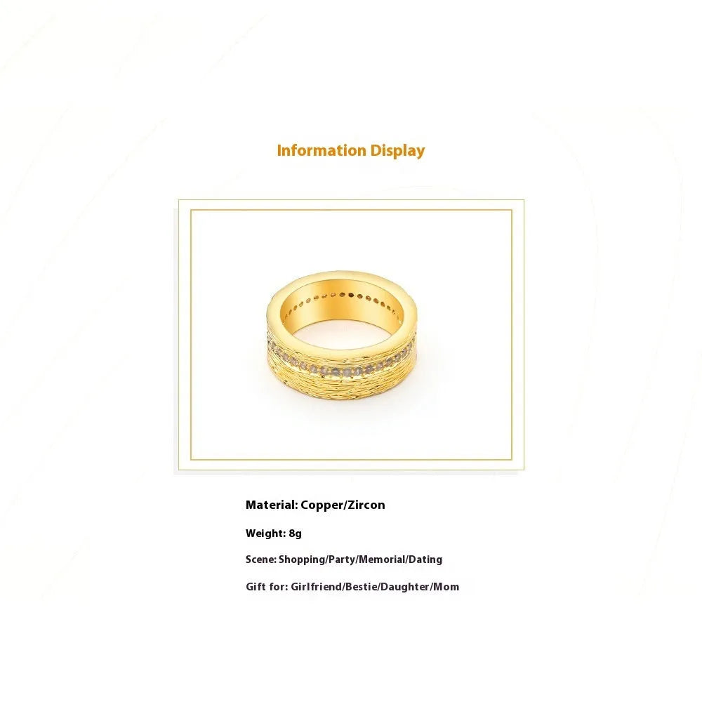 Gold geometric women's ring with clear zircon stone on copper band.