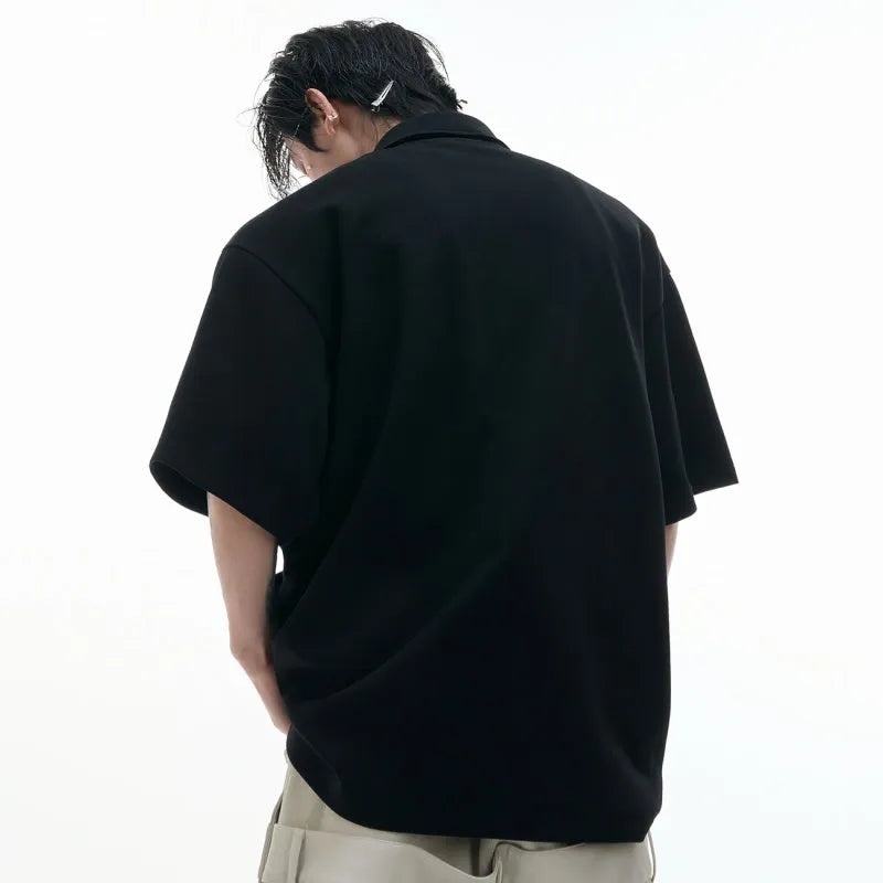 Men's loose fit deconstructed collar polo shirt with Giant Land Turtle geometric pattern in black.