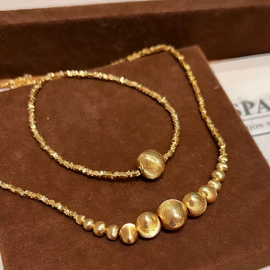 Unisex retro gradient cateye necklace and bracelet set in gold finish with broken silver cat eye accents
