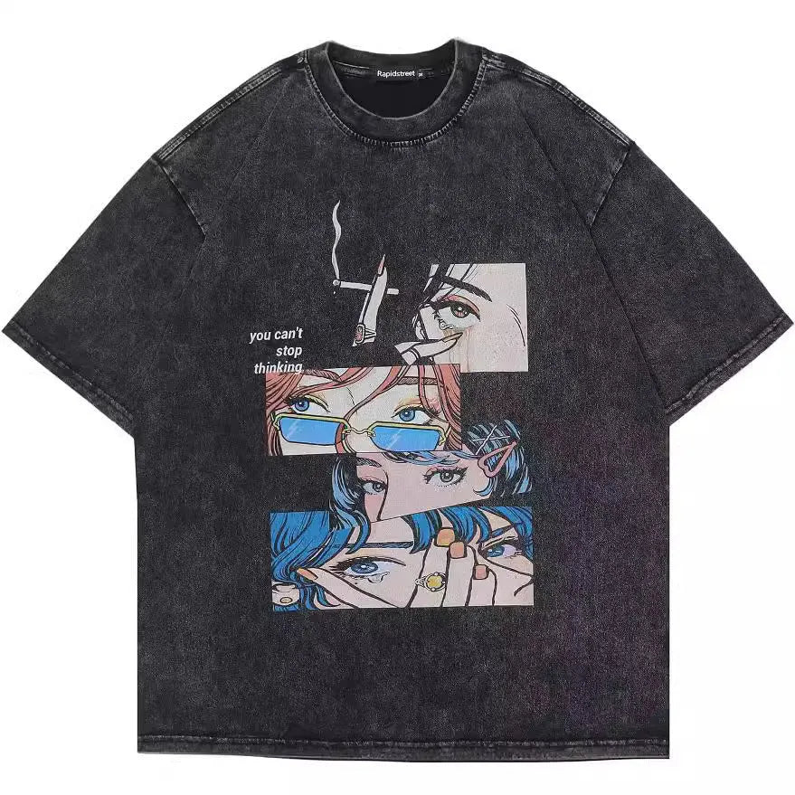 Man wearing a loose-fit black T-shirt with a colourful cartoon print on the front, short sleeves.