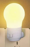 Compact round plug-in bedside lamp in white, blue, or pink for night feeding.