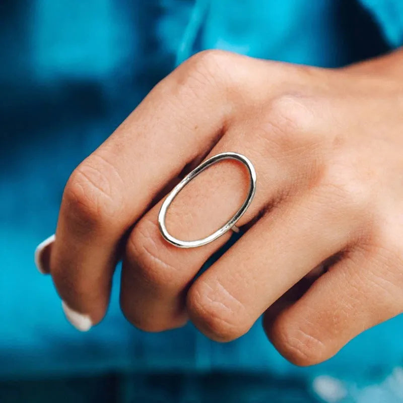 Women's geometric copper ring with zircon inlay in rose gold finish on white background