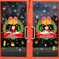 Two large colourful cartoon electrostatic window stickers, each measuring 60cm by 45cm, on a glass surface.