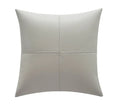 Soft cowhide leather pillow cover in a solid colour on a sofa.