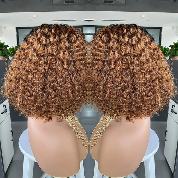 Ombre curly human hair lace wig in black with oblique bangs on a mannequin head