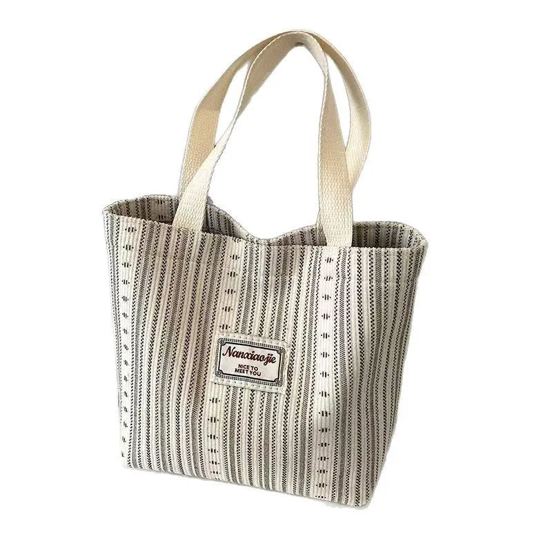 Japanese-style corduroy shoulder bag in dark brown, showing the textured fabric and adjustable strap.