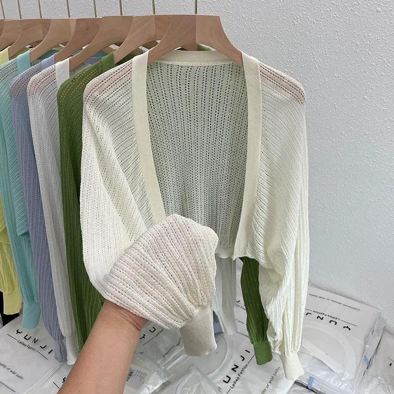 Women's linen blouse with hollow-out design and long lantern sleeves in apricot colour