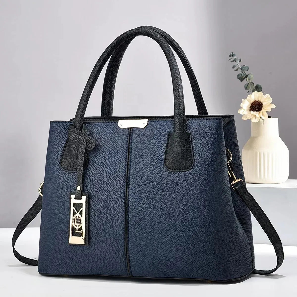 Soft PU fashion handbag with leather shoulder strap in horizontal square shape