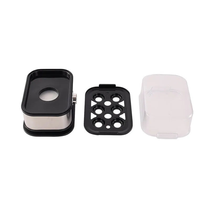 Black stainless steel portable egg boiler with a carry belt on a white background.