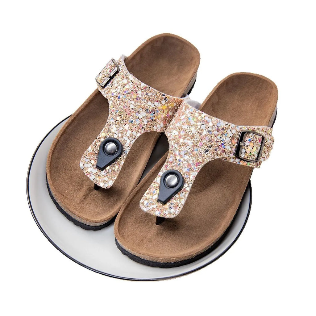 Women's cork flip-flops with frosted metallic artificial leather upper and textured PVC sole.
