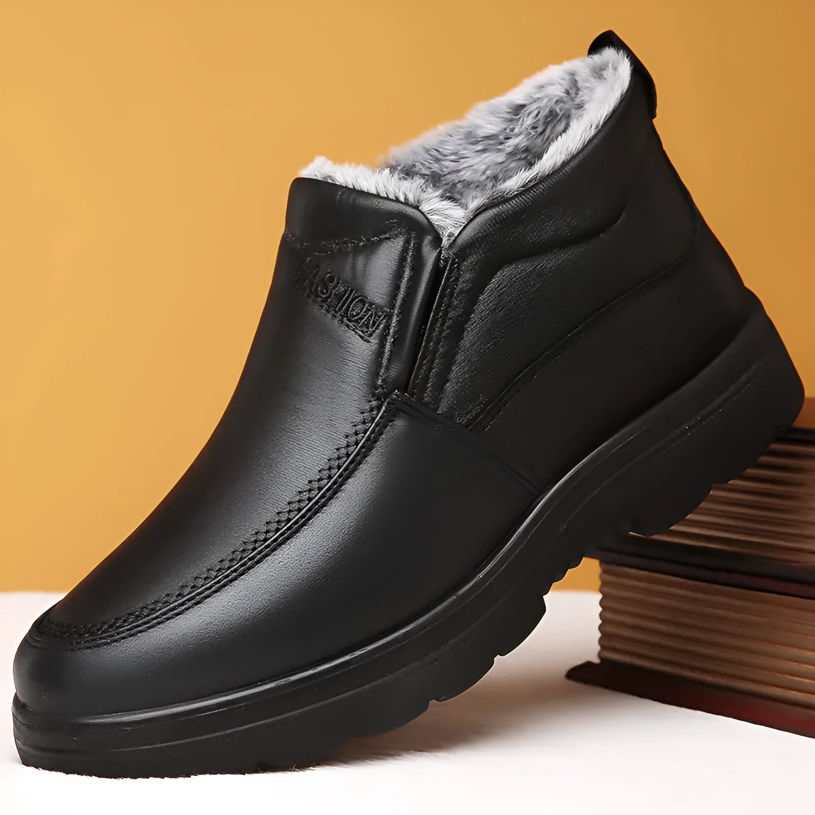 Men's black winter slip-on shoes with fleece lining and rubber sole on grey background