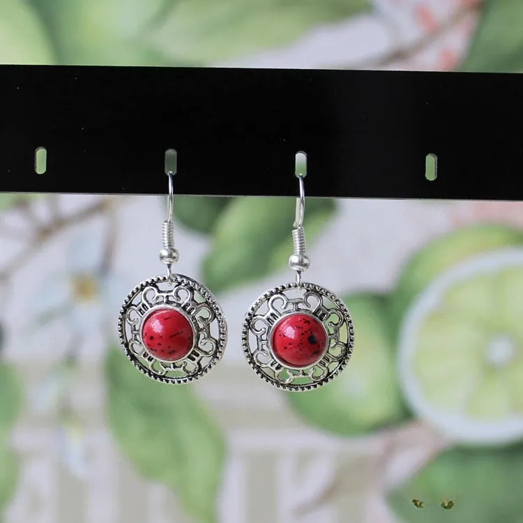 Geometric ethnic earrings with Tibetan silver and turquoise stones in traditional Miao style