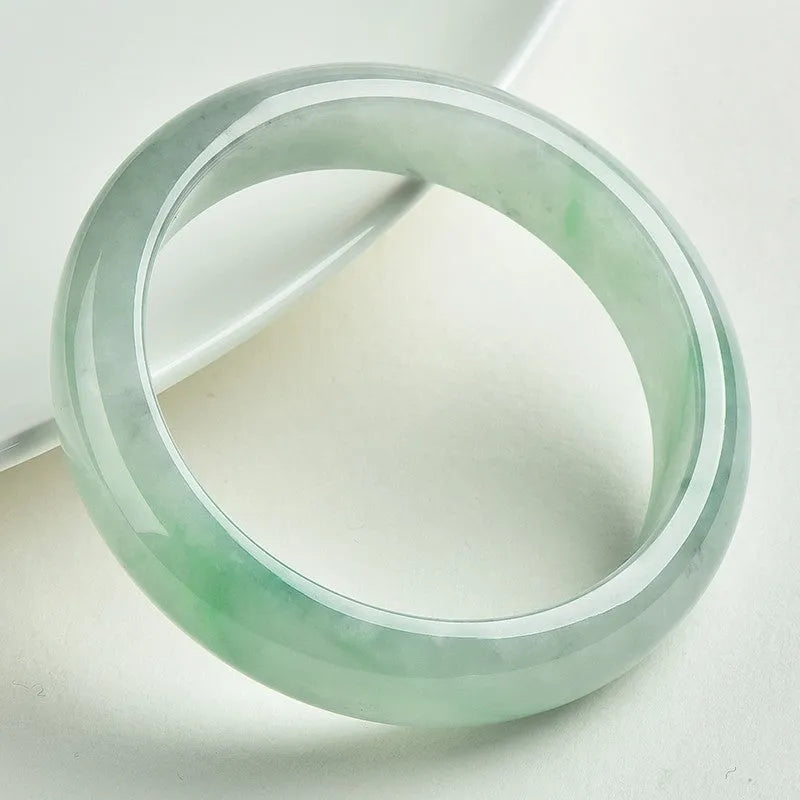 Light green jade bracelet showing natural stone material and simple design for unisex wear