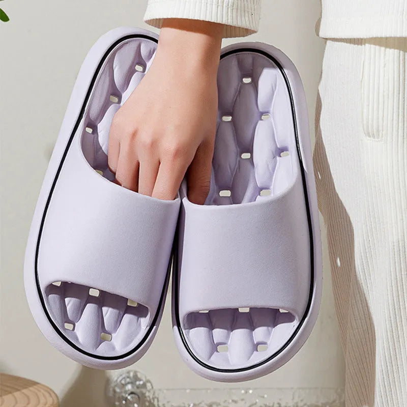 Non-slip EVA bathroom slippers with thick sole and hollow upper in grey, side view