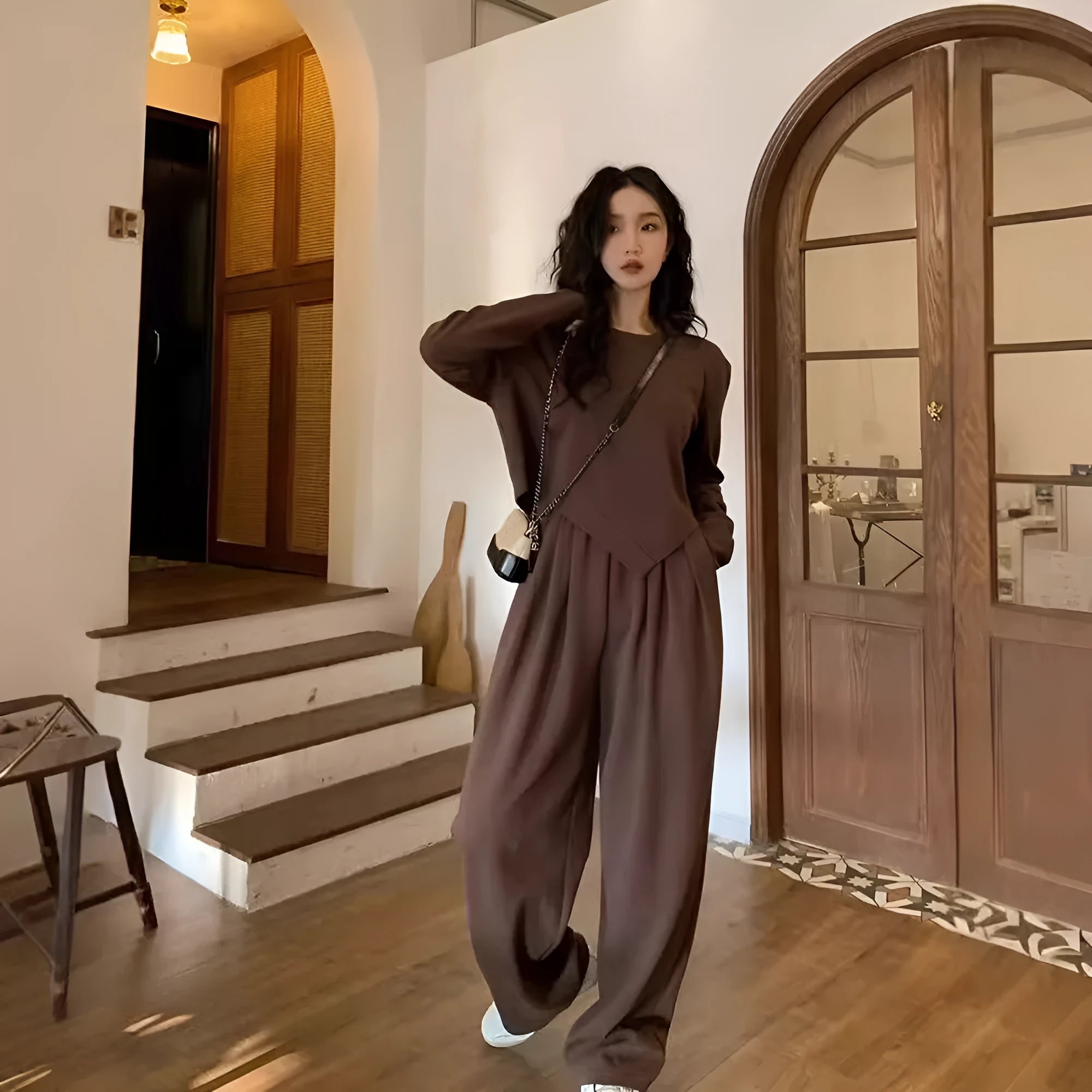 Women's khaki coloured loose-fitting sports suit with long sleeve top and full length trousers