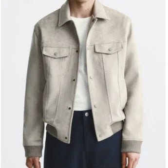 A Mink coloured velvet jacket with British style tailoring and long sleeves, laying flat.