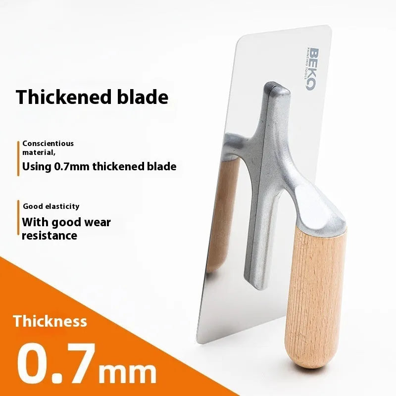Stainless steel putty scraper with wooden handle for applying filler to walls and floors.