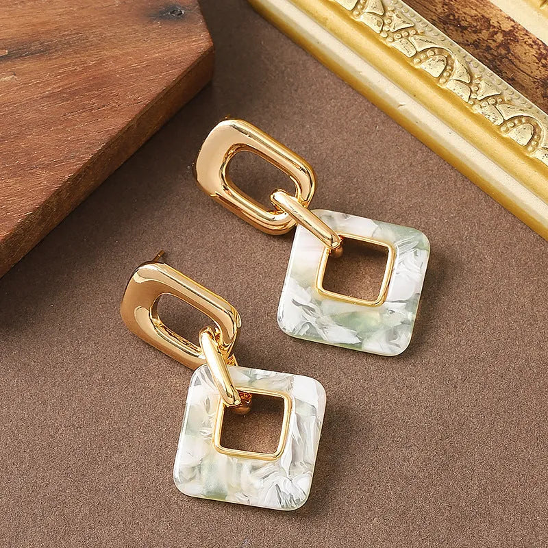 Hollow geometric square earrings with chamfered corners in silver or black