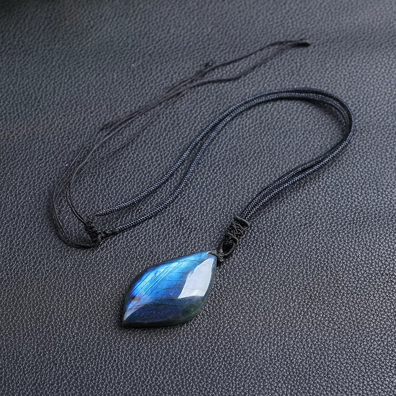 Natural labradorite leaf pendant necklace with blue moonlight effect on white background